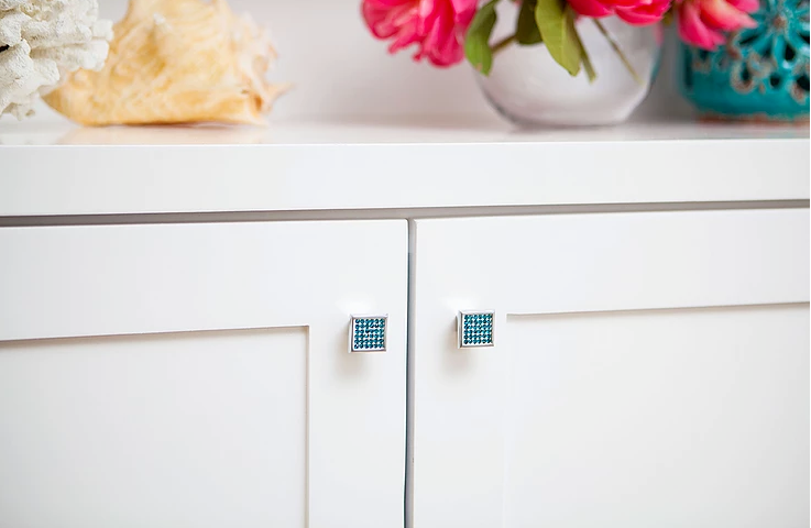 white cabinet with blue crystal square cabinet knobs