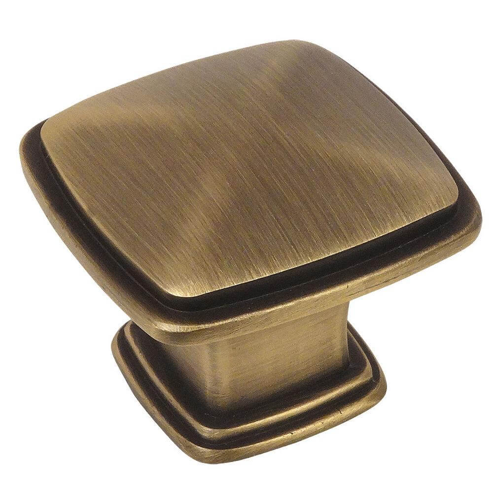Subtle pyramid drawer knob in brushed antique brass finish with one and a quarter inch length